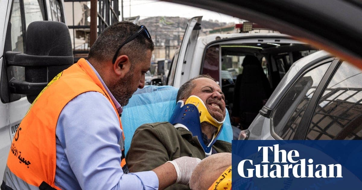 Settlers Beat AFP Photographer With Rifle Butts Near Aqraba as Israeli Soldiers Stand 500 Meters Away