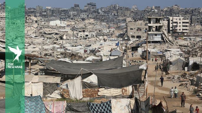 A view of the devastated city as workers salvage scrap iron from homes, destroyed in the war, to recycle for use in refugee tents on August 22, 2026 in Gaza City,