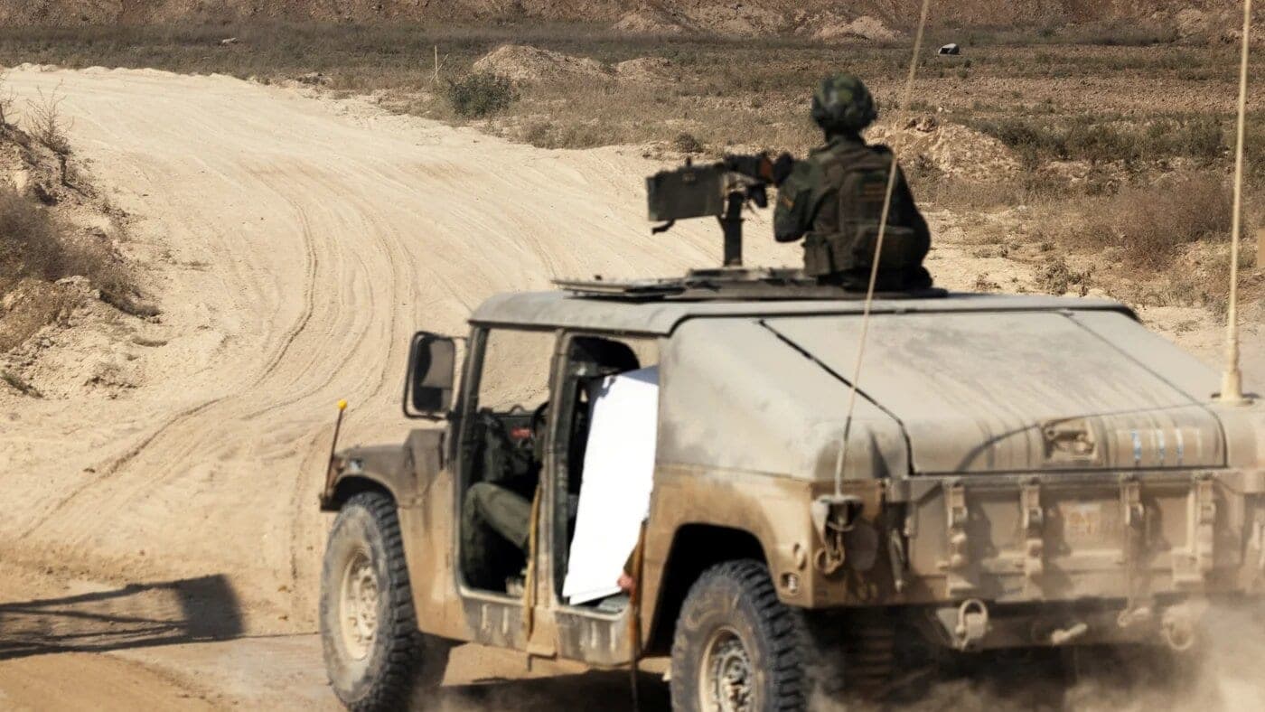Israeli soldiers enter the Gaza Strip in a military vehicle 5 November 2025 (Nir Elias/Reuters)