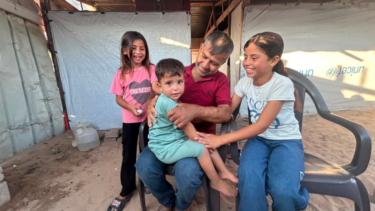 Hatem Jadallah, 44, with his children at the family's tent in al-Mawasi, after a dialysis session at Nasser Medical Complex. Mohammed is three and a half, Mariam ten and Leen eight. Jadallah began dialysis in August 2024 and says the war brought on his kidney failure.